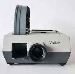 1960s–2000s A device for displaying photographic slides. It faded as digital photo displays and PowerPoint presentations became standard. slide projector